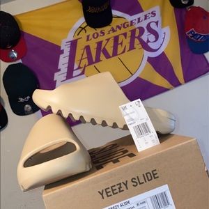 brand new yeezy slides, never worn, verified.